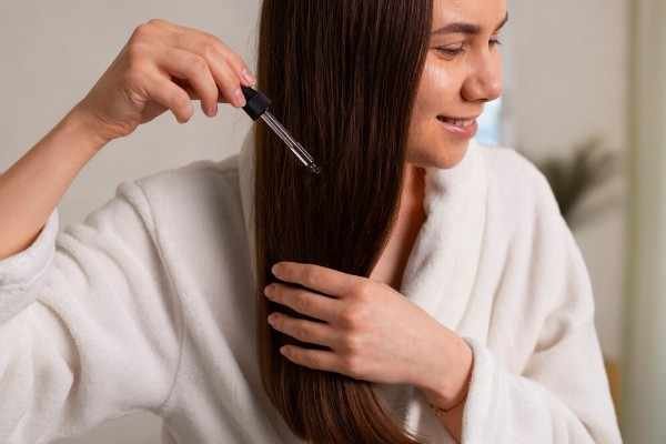 women who is caring her hair to grow hair fast